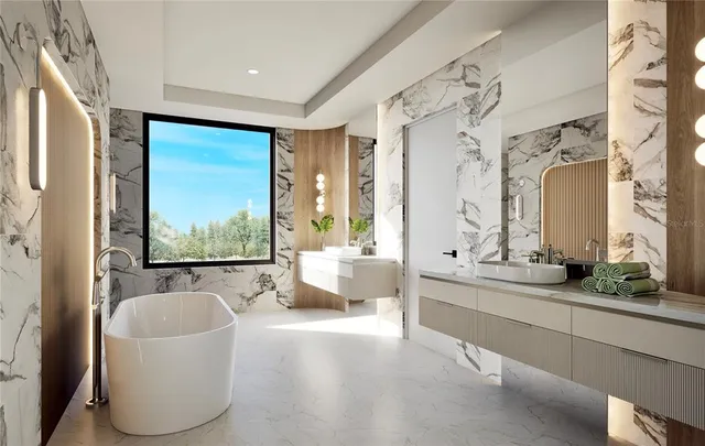 a bathroom with a tub sink and mirror