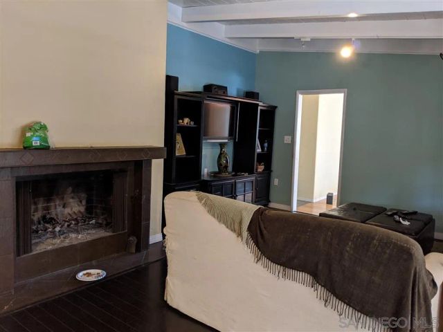 a bedroom with a bed and a fireplace