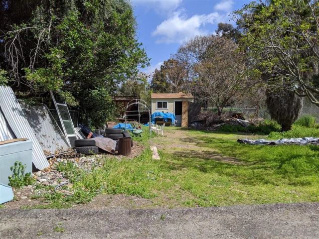 a view of a house with a yard porch and sitting area