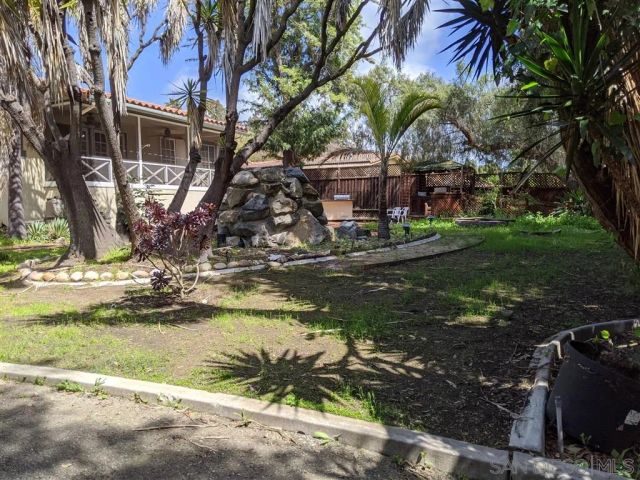 a view of a water fountain in front of a house