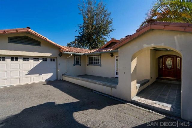 a front view of a house with parking garage