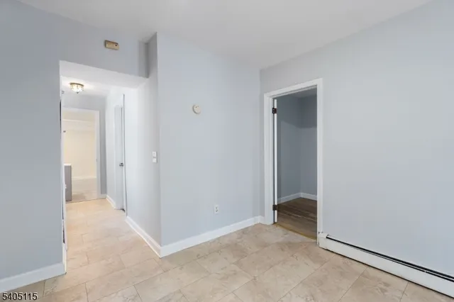 a view of an empty room and closet area