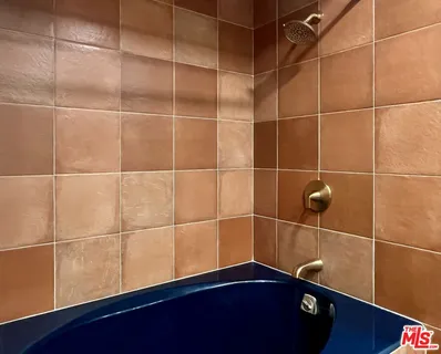 a view of a hallway with washer and dryer