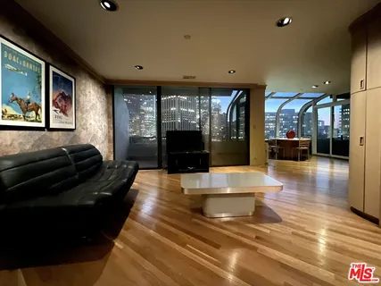 a lobby with furniture and a potted plant