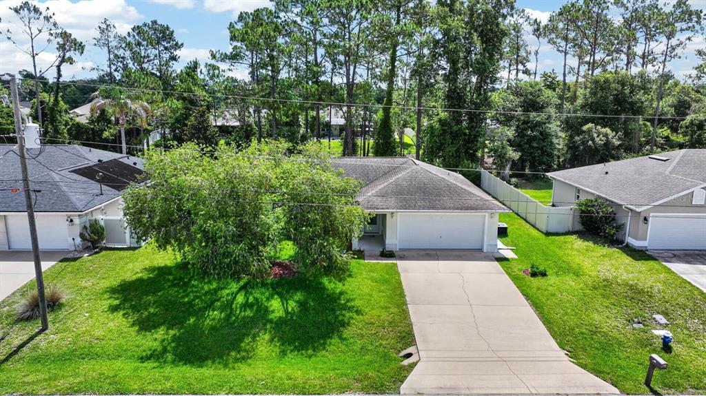 80 Roxboro Drive Palm Coast, FL 32164 - Photo 33 of 39 a view of a garden with pathway