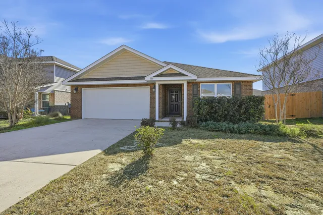 a kitchen with stainless steel appliances a sink stove refrigerator and cabinets