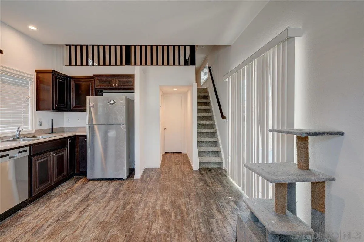 7495 Oakland Road, Unit 32 La Mesa, CA 91942 - Photo 5 of 16 a view of kitchen with sink microwave and refrigerator