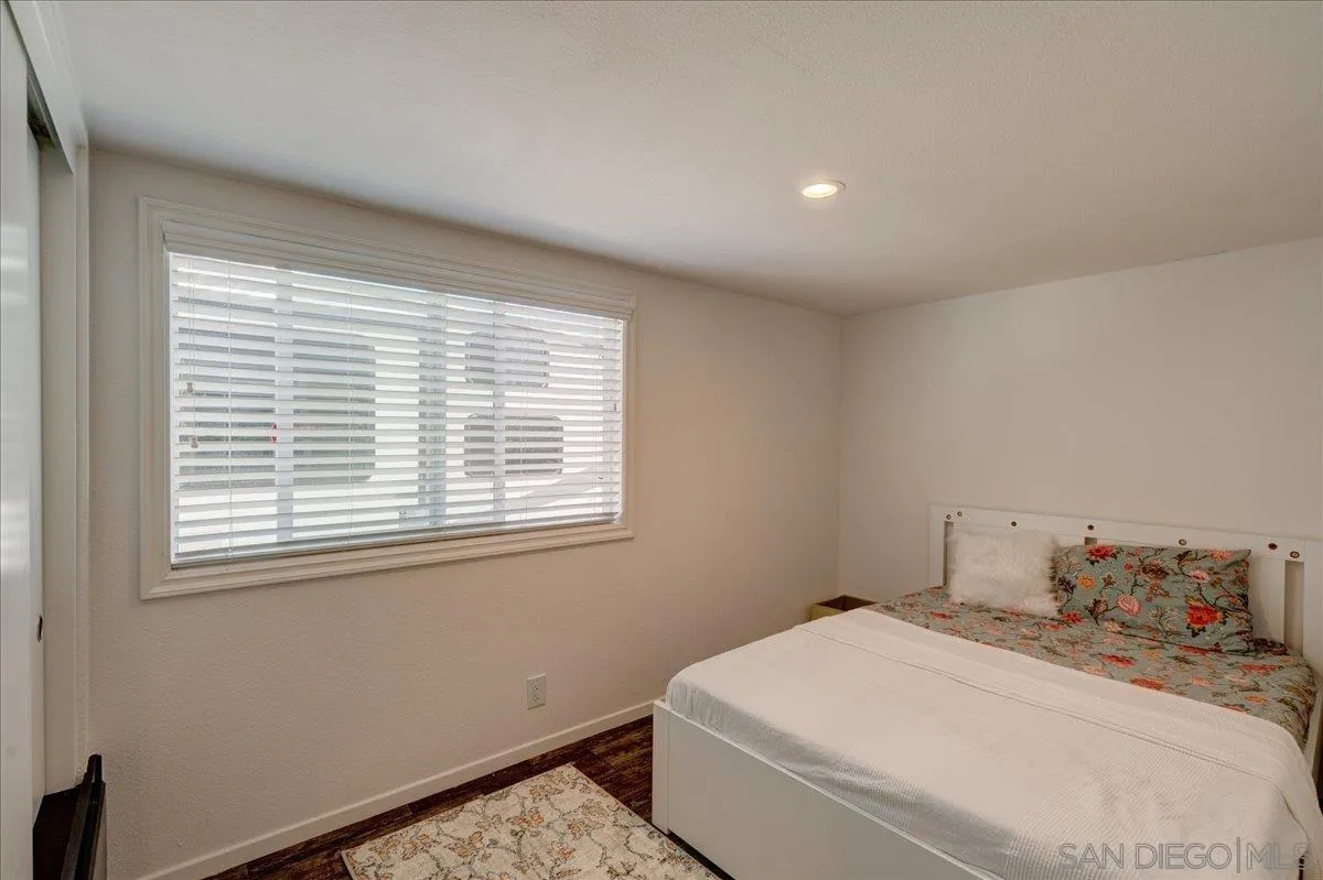 7495 Oakland Road, Unit 32 La Mesa, CA 91942 - Photo 6 of 16 a bedroom with a bed and a window