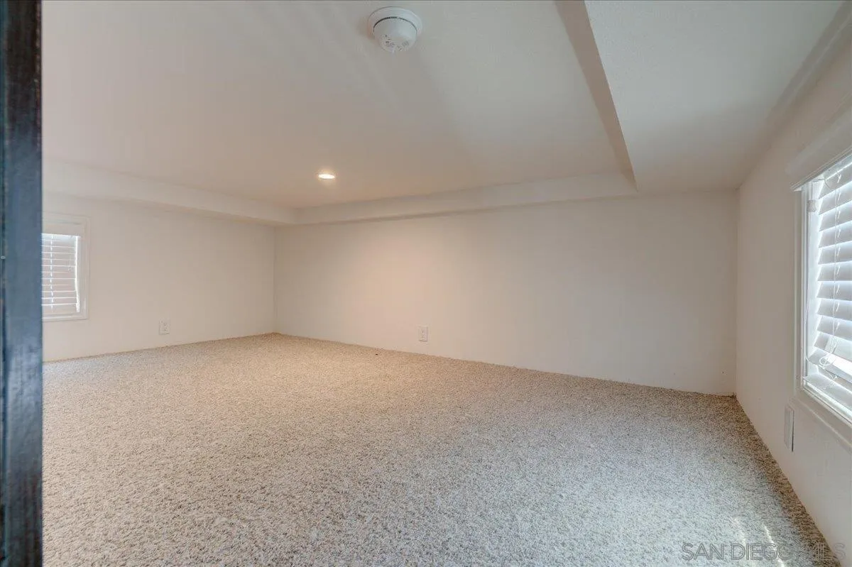 7495 Oakland Road, Unit 32 La Mesa, CA 91942 - Photo 9 of 16 wooden floor in an empty room with a window