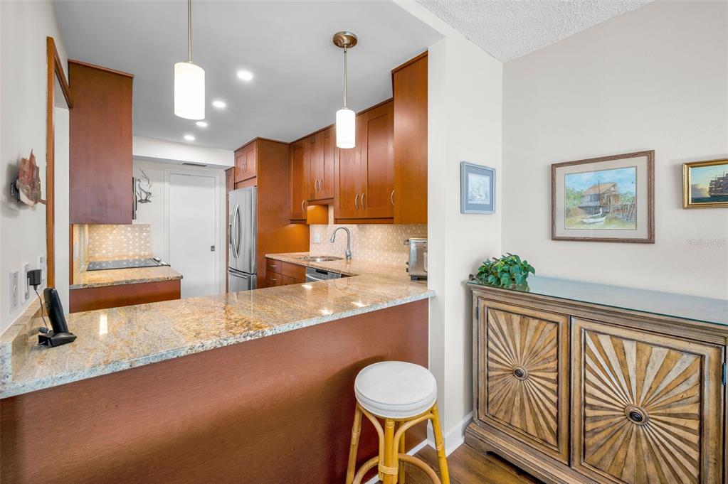 632 Edgewater Drive, Unit 433 Dunedin, FL 34698 - Photo 17 of 42 a bathroom with a sink a toilet and mirror