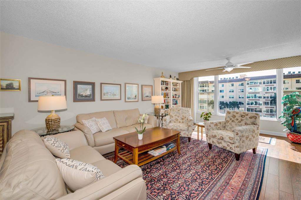 632 Edgewater Drive, Unit 433 Dunedin, FL 34698 - Photo 7 of 42 a living room with furniture and a large window