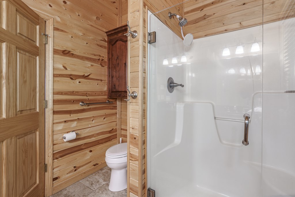 509 Lonesome Pine Road Murphy, NC 28906 - Photo 24 of 70 a bathroom with a granite countertop shower a toilet and a sink
