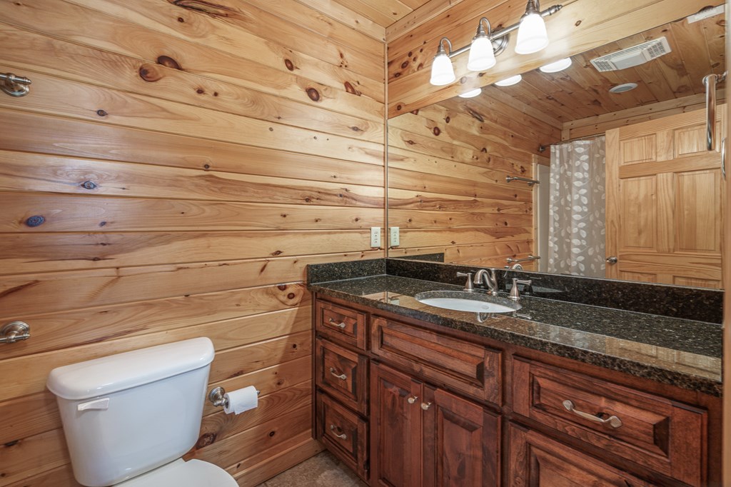 509 Lonesome Pine Road Murphy, NC 28906 - Photo 30 of 70 a bathroom with a toilet sink and mirror