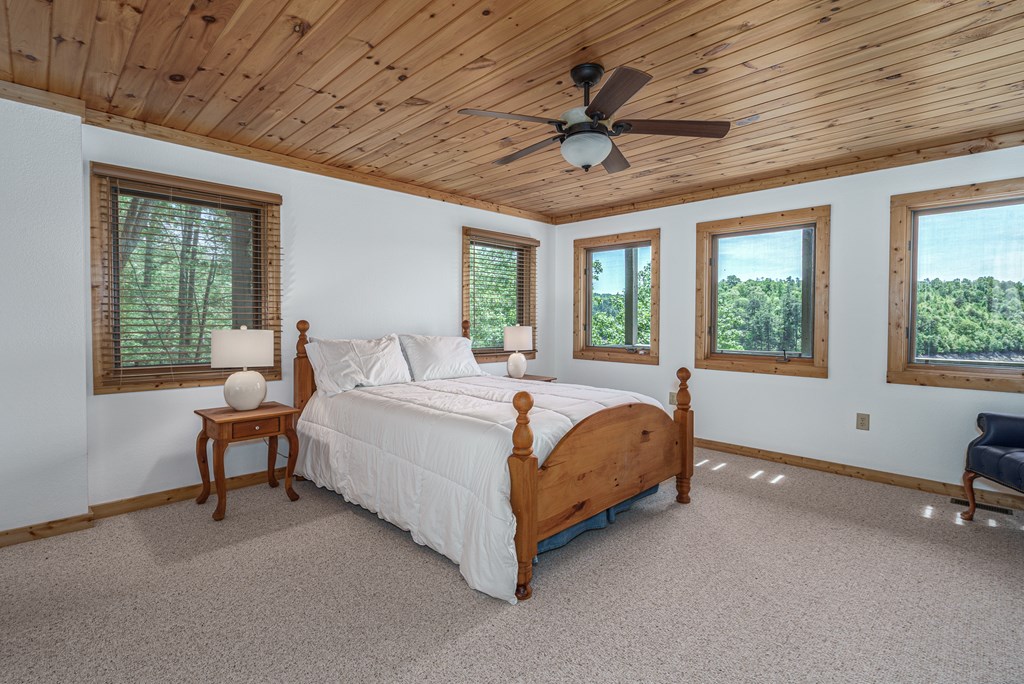 509 Lonesome Pine Road Murphy, NC 28906 - Photo 31 of 70 a bed sitting in a spacious bedroom next to a window