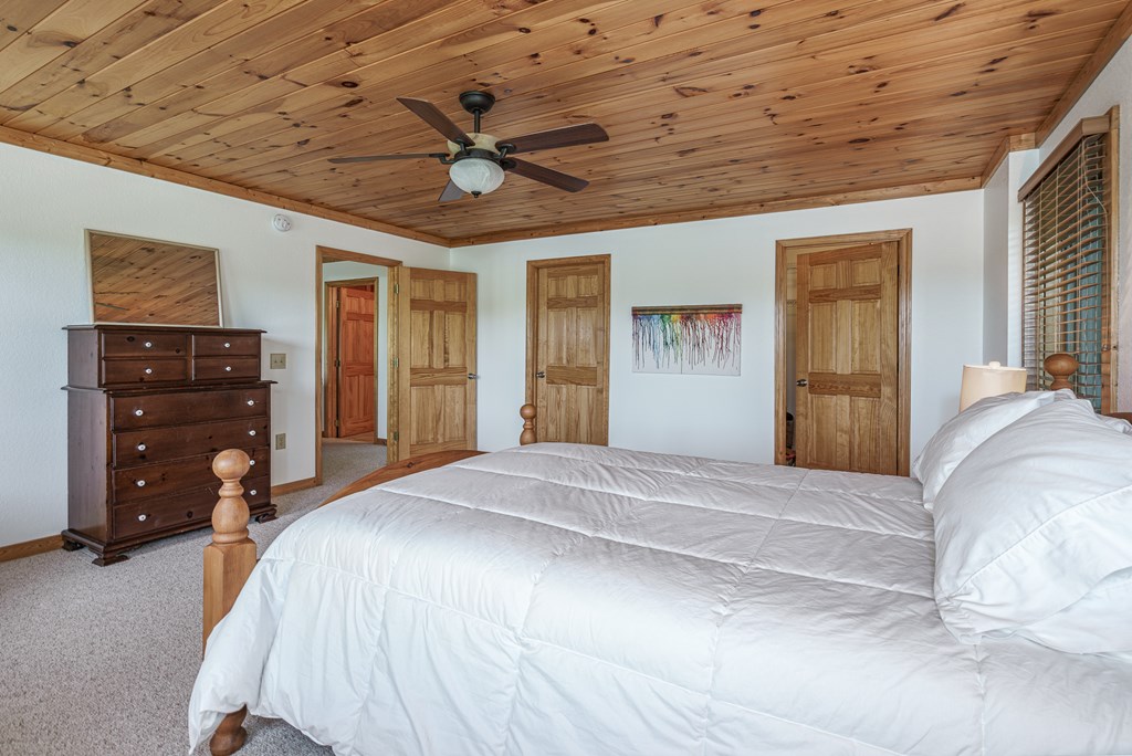 509 Lonesome Pine Road Murphy, NC 28906 - Photo 33 of 70 a bedroom with a bed closet and dresser