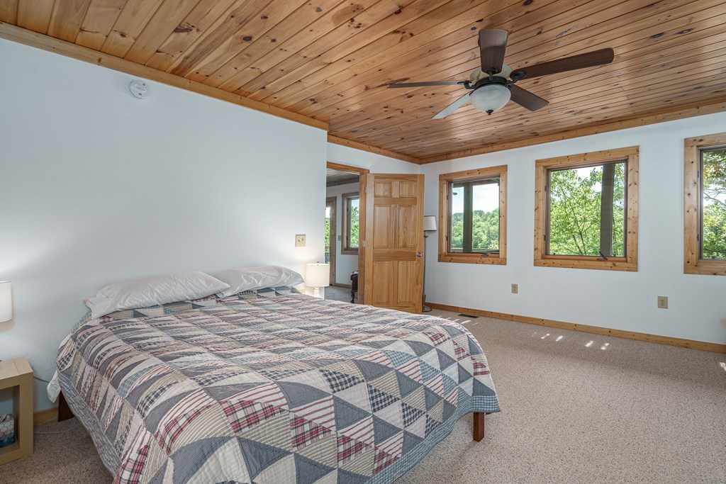 509 Lonesome Pine Road Murphy, NC 28906 - Photo 37 of 70 a large bed sitting in a spacious bedroom next to a window