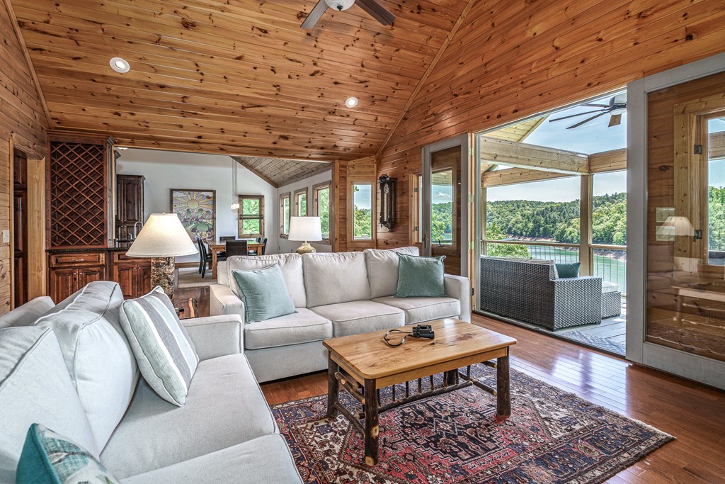 509 Lonesome Pine Road Murphy, NC 28906 - Photo 6 of 70 a living room with furniture a wooden floor and large windows