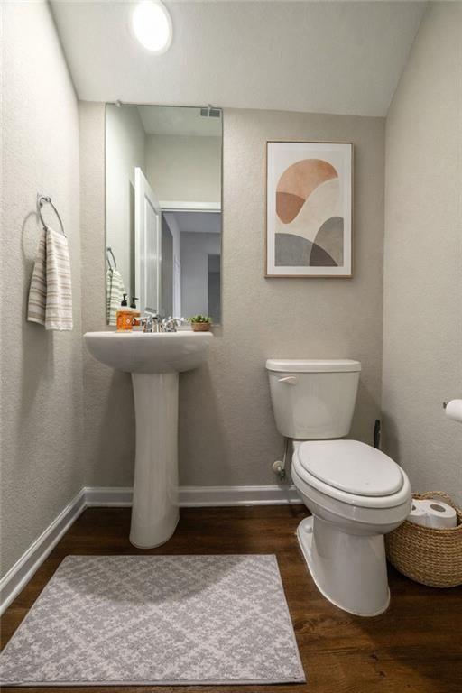 735 Walnut Creek Circle Pendergrass, GA 30567 - Photo 9 of 29 a bathroom with a toilet and a mirror