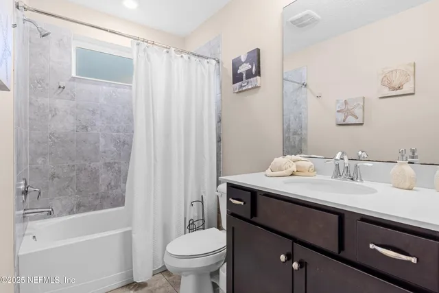 a kitchen with a stove a sink a microwave and cabinets