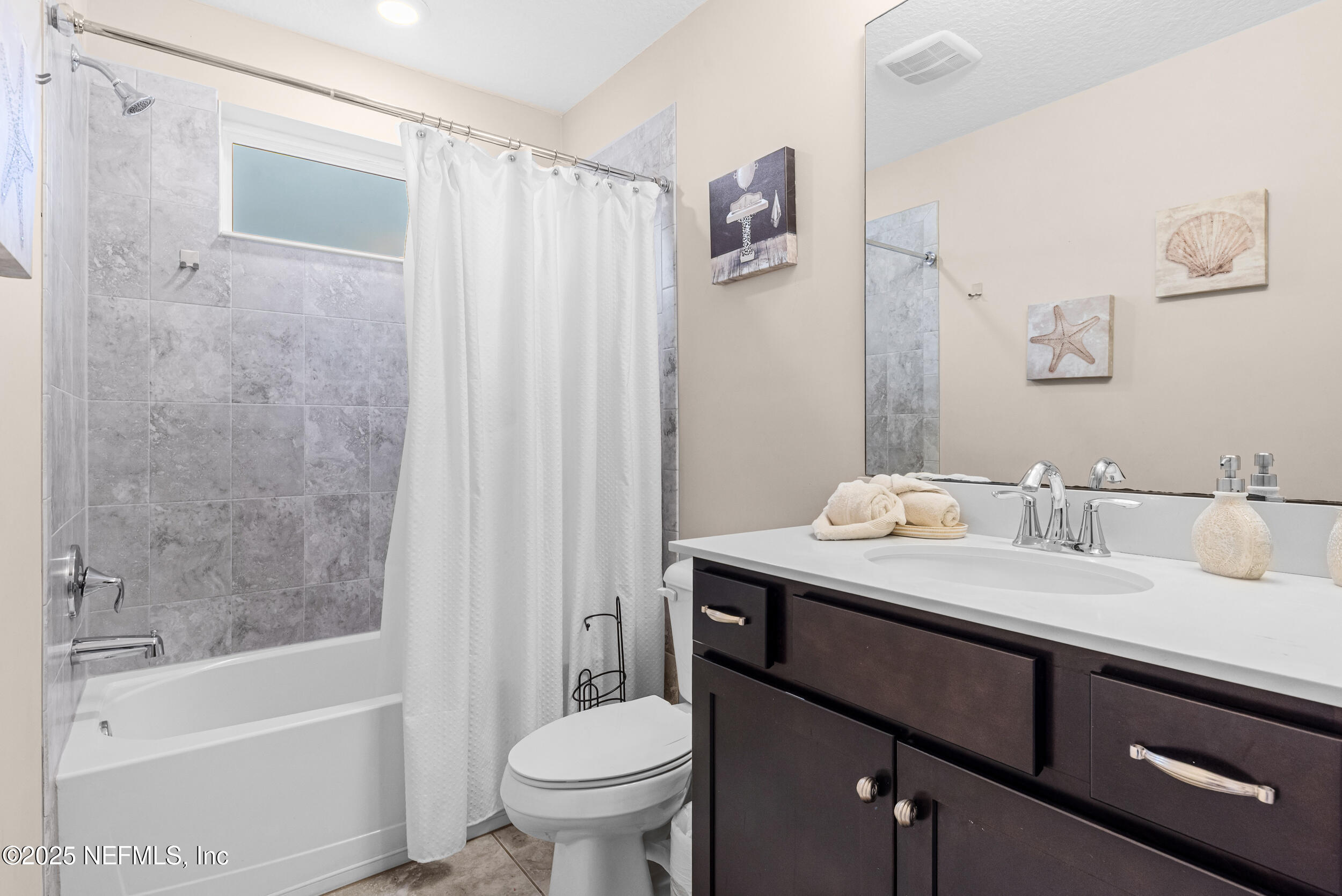 15672 Tisons Bluff Road Jacksonville, FL 32218 - Photo 17 of 42 a bathroom with a granite countertop sink toilet and shower