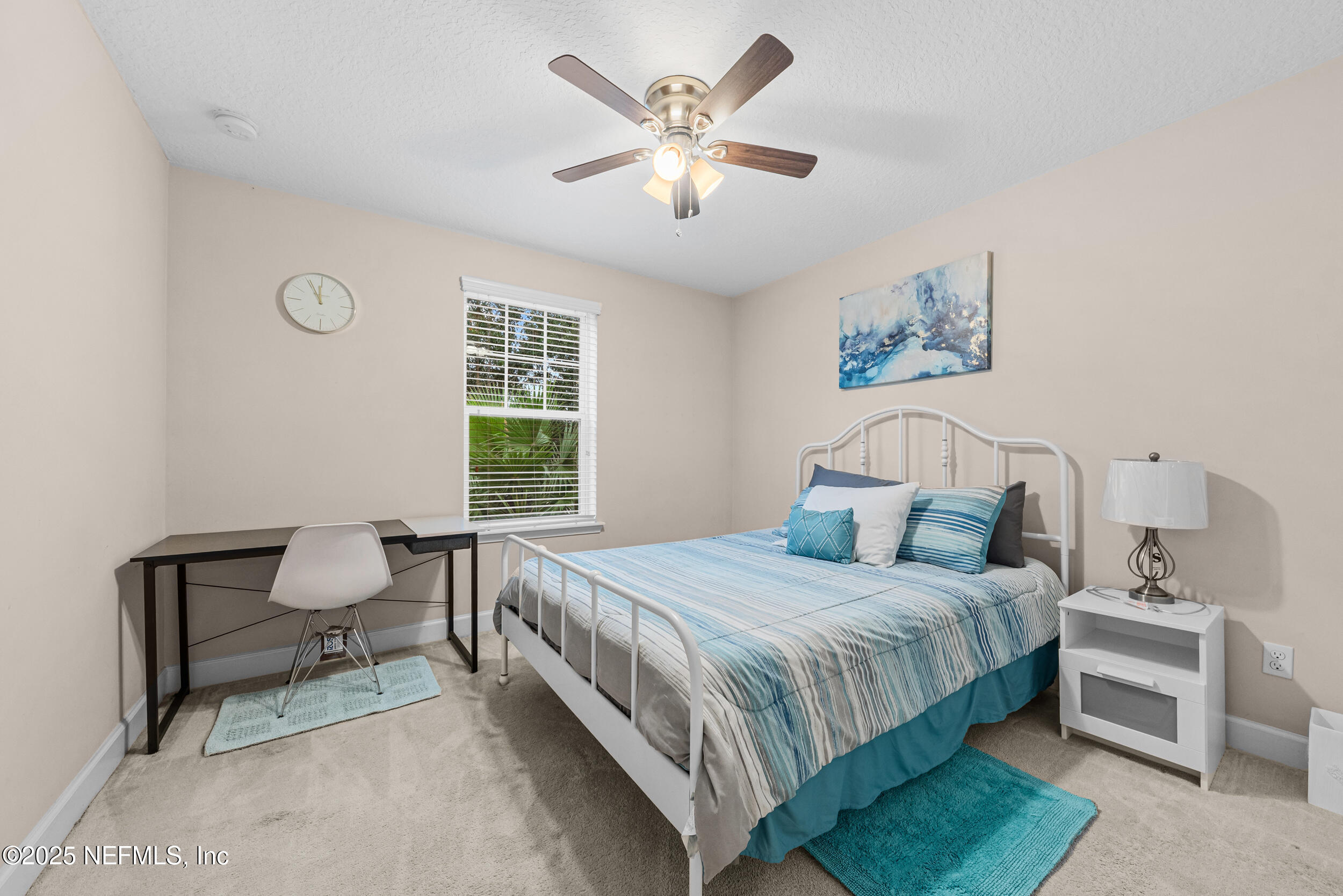 15672 Tisons Bluff Road Jacksonville, FL 32218 - Photo 19 of 42 a bedroom with a bed and a chair
