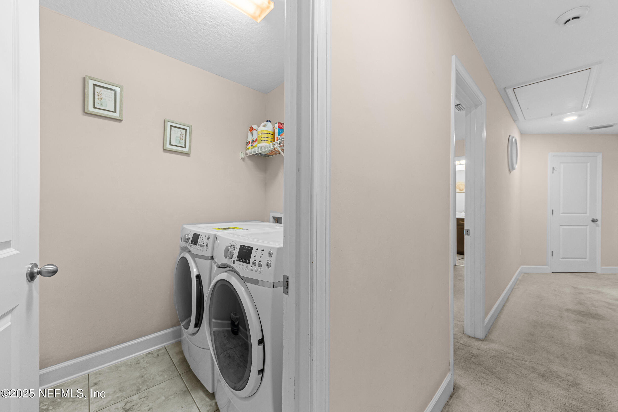 15672 Tisons Bluff Road Jacksonville, FL 32218 - Photo 22 of 42 a utility room with dryer and washer