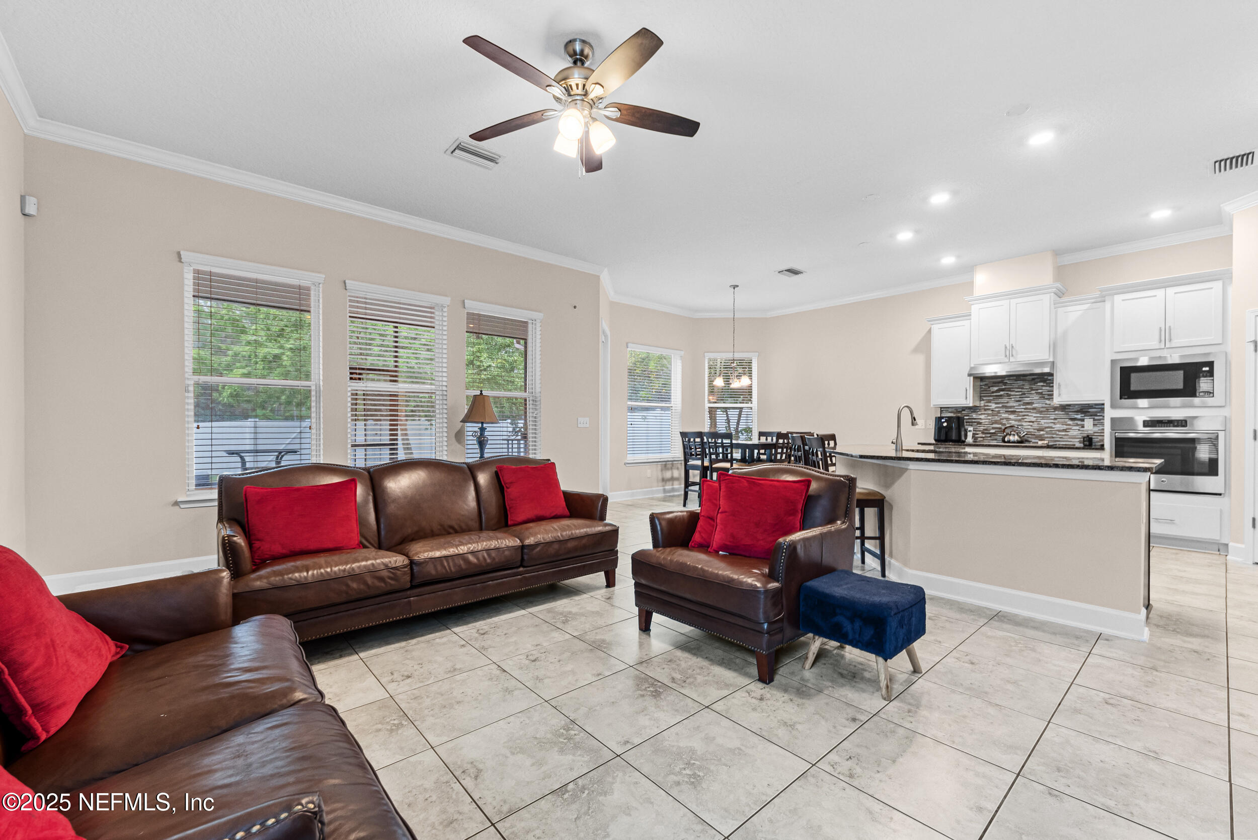 15672 Tisons Bluff Road Jacksonville, FL 32218 - Photo 24 of 42 a living room with furniture and kitchen view