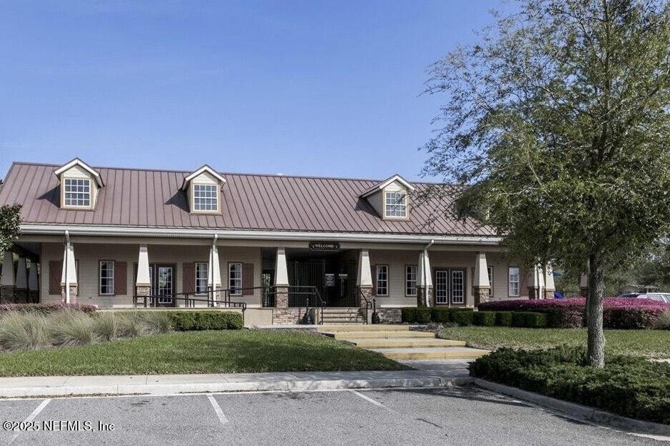 15672 Tisons Bluff Road Jacksonville, FL 32218 - Photo 34 of 42 a front view of a house with a garden