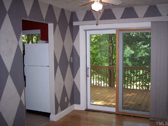 2013 Shenandoah Road Raleigh, NC 27603 - Photo 3 of 12 Dining Room opens to Living Room and walks to Kitchen or back private Deck.