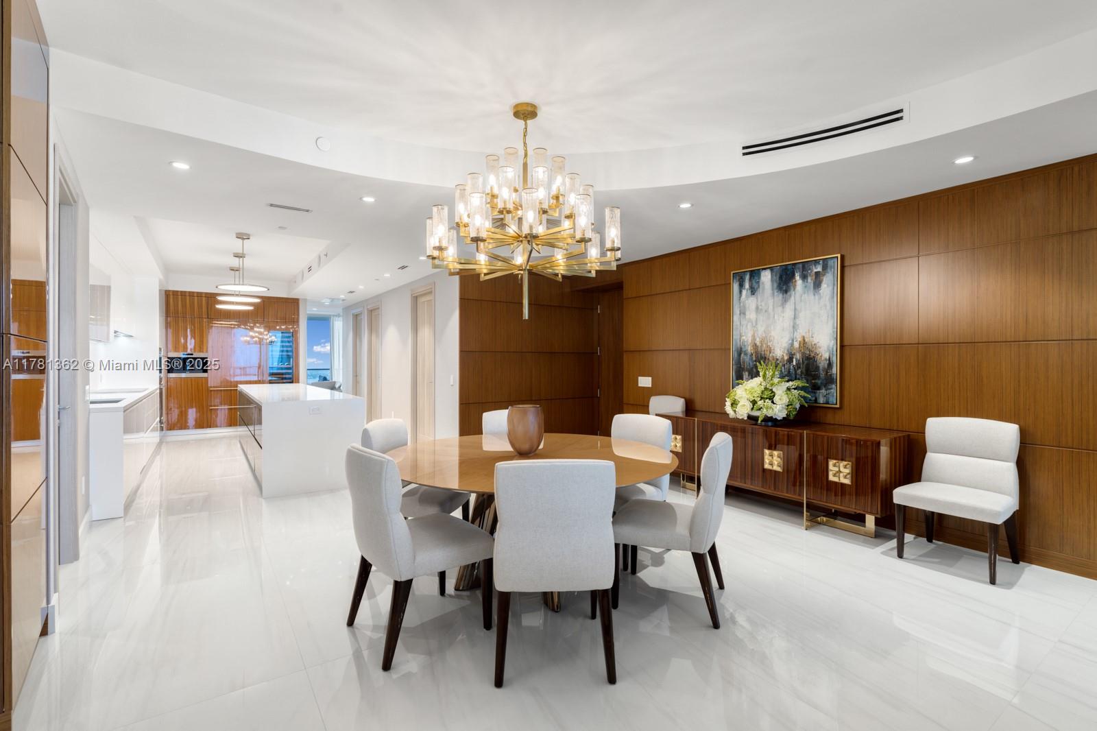 9705 Collins Avenue, Unit 2604N Bal Harbour, FL 33154 - Photo 11 of 42 a view of a dining room with furniture and chandelier