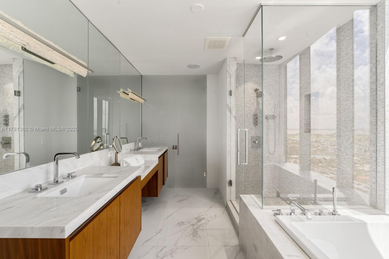 9705 Collins Avenue, Unit 2604N Bal Harbour, FL 33154 - Photo 16 of 42 a bathroom with a double vanity sink mirror double and shower