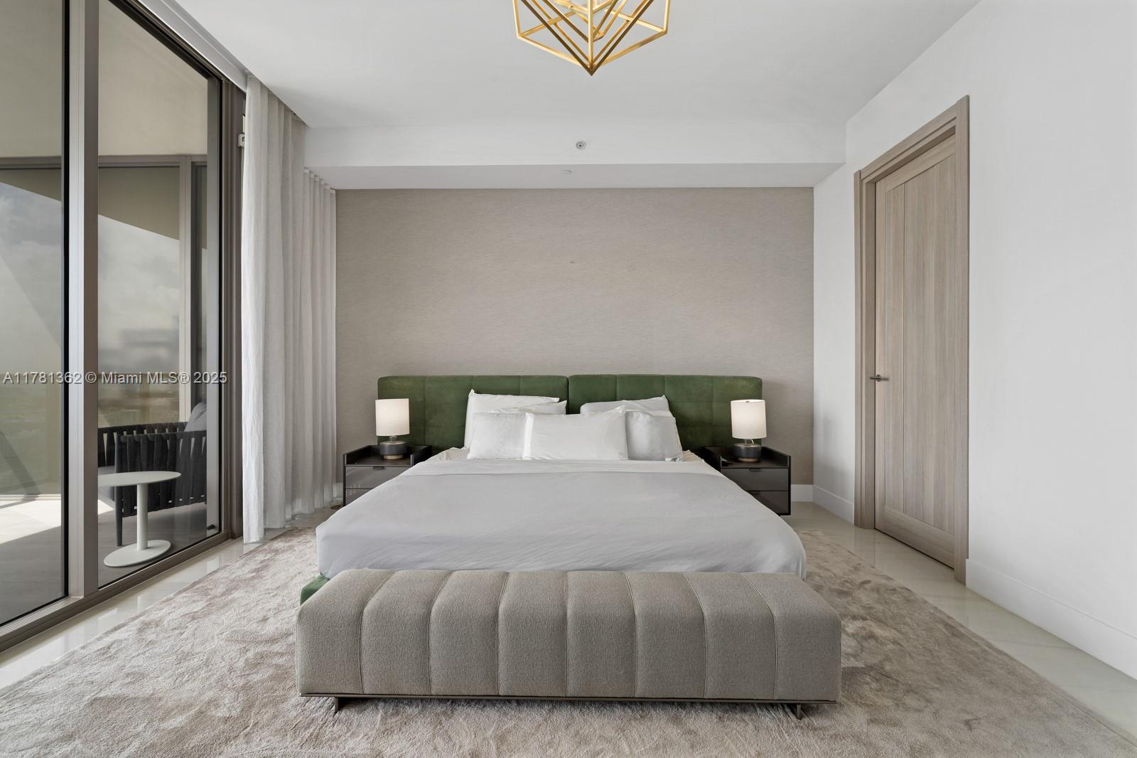 9705 Collins Avenue, Unit 2604N Bal Harbour, FL 33154 - Photo 23 of 42 a bedroom with a bed and large mirror