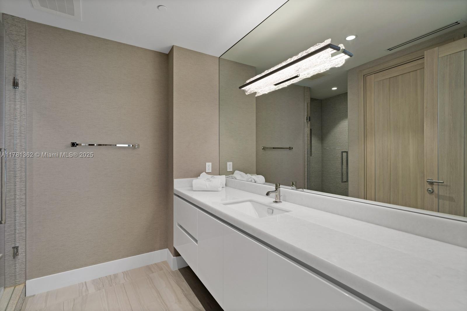 9705 Collins Avenue, Unit 2604N Bal Harbour, FL 33154 - Photo 30 of 42 a bathroom with a sink and mirror