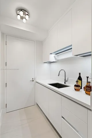 a utility room with washing machine