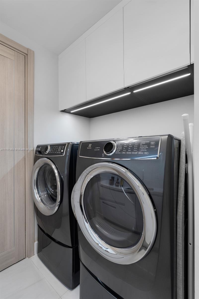 9705 Collins Avenue, Unit 2604N Bal Harbour, FL 33154 - Photo 34 of 42 a utility room with washing machine