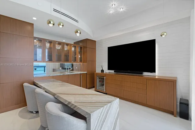 a room with cabinets and flat screen tv