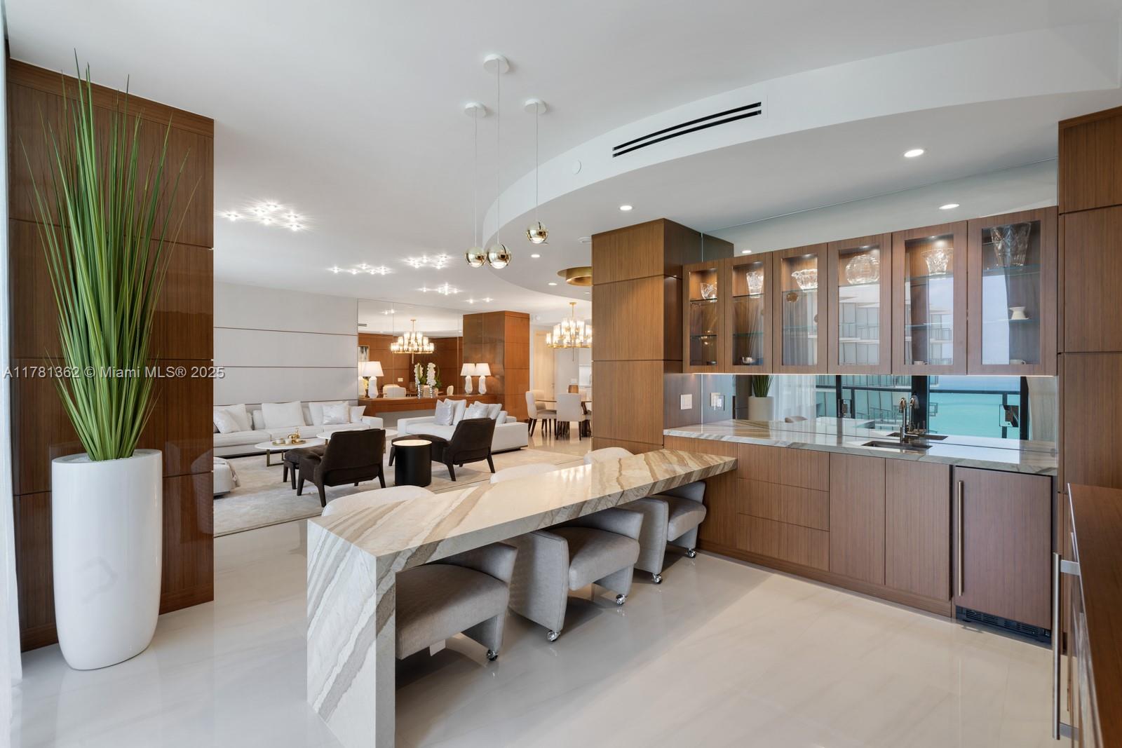 9705 Collins Avenue, Unit 2604N Bal Harbour, FL 33154 - Photo 8 of 42 a group of people sitting in a room