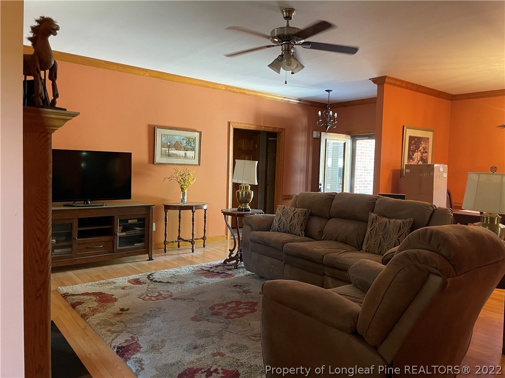 127 Doane Ranch Road Raeford, NC 28376 - Photo 14 of 47 a living room with furniture and a flat screen tv