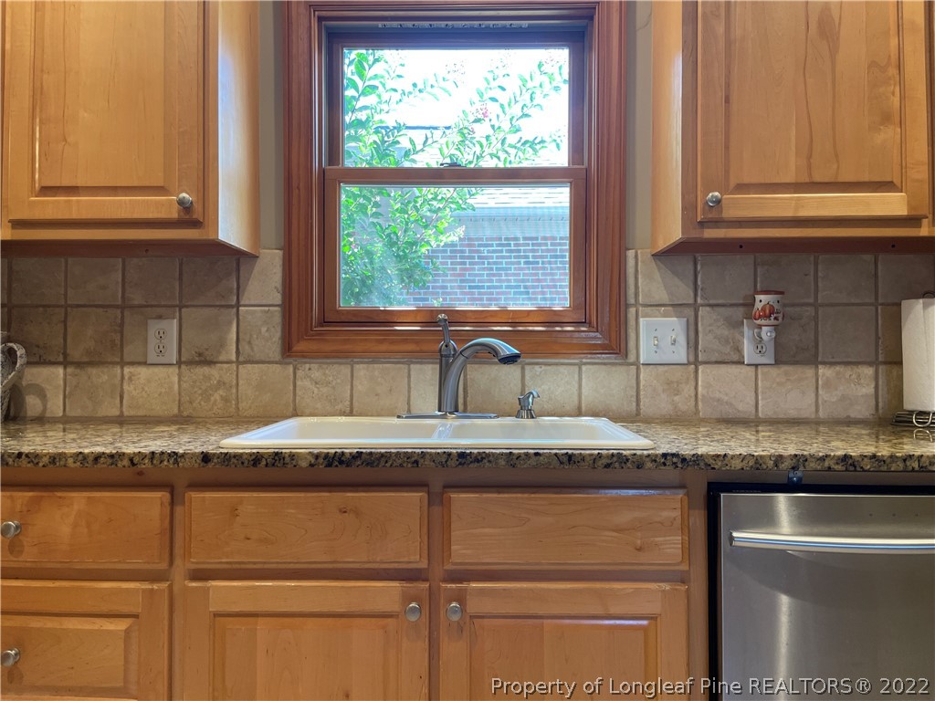 127 Doane Ranch Road Raeford, NC 28376 - Photo 23 of 47 a kitchen with granite countertop cabinets and window