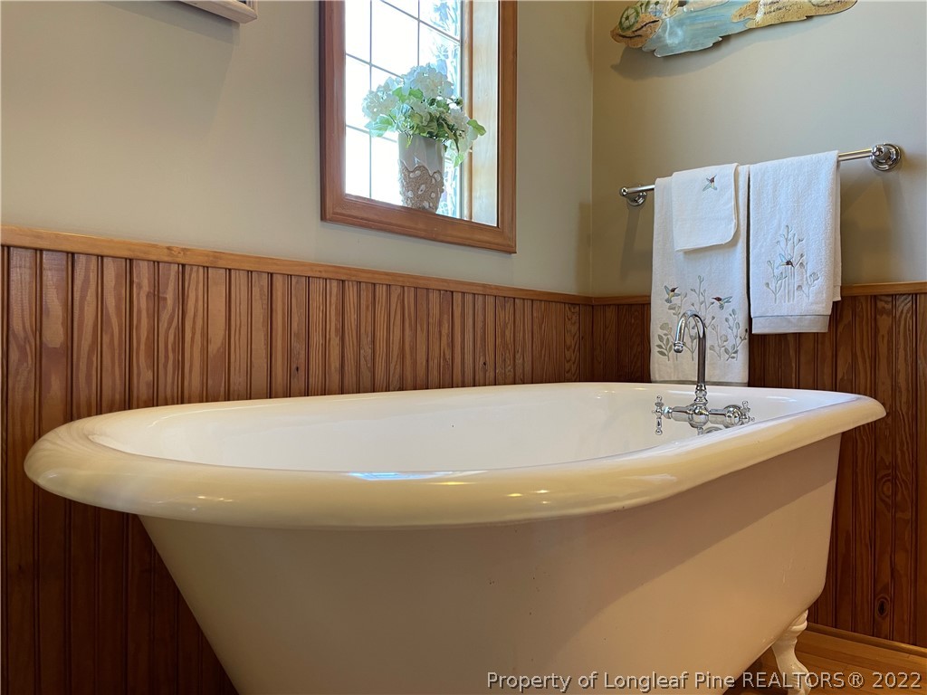 127 Doane Ranch Road Raeford, NC 28376 - Photo 29 of 47 a white bath tub sitting in a bathroom