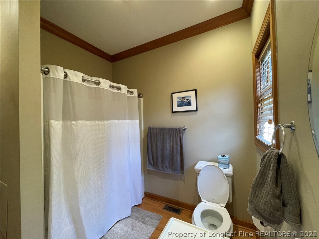 127 Doane Ranch Road Raeford, NC 28376 - Photo 35 of 47 a bathroom with a toilet and a shower