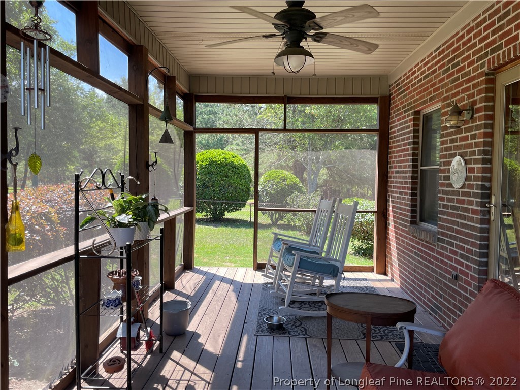 127 Doane Ranch Road Raeford, NC 28376 - Photo 38 of 47 a view of a dining room with furniture window and wooden floor