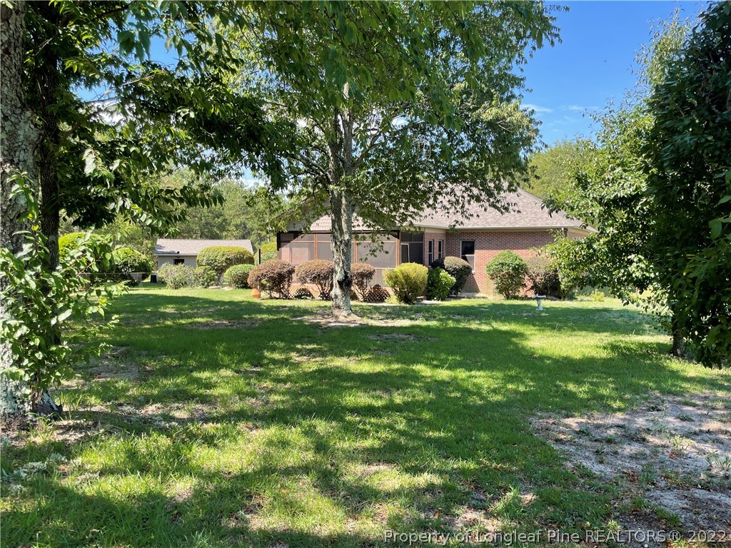 127 Doane Ranch Road Raeford, NC 28376 - Photo 41 of 47 a view of house with backyard