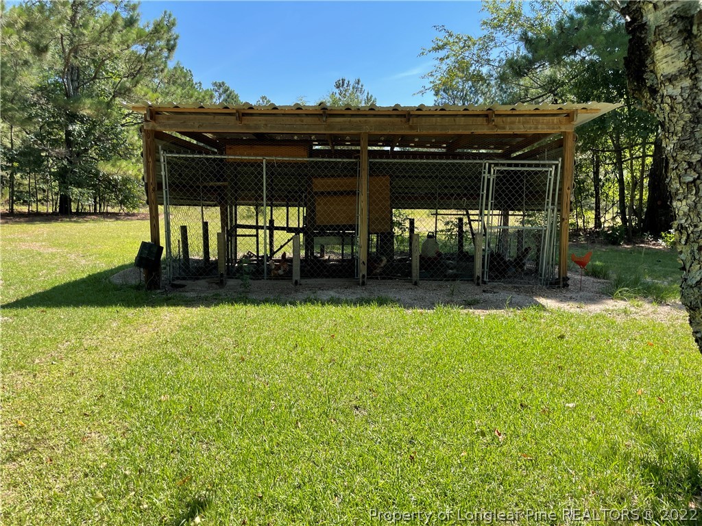 127 Doane Ranch Road Raeford, NC 28376 - Photo 46 of 47 a front view of a house with a yard