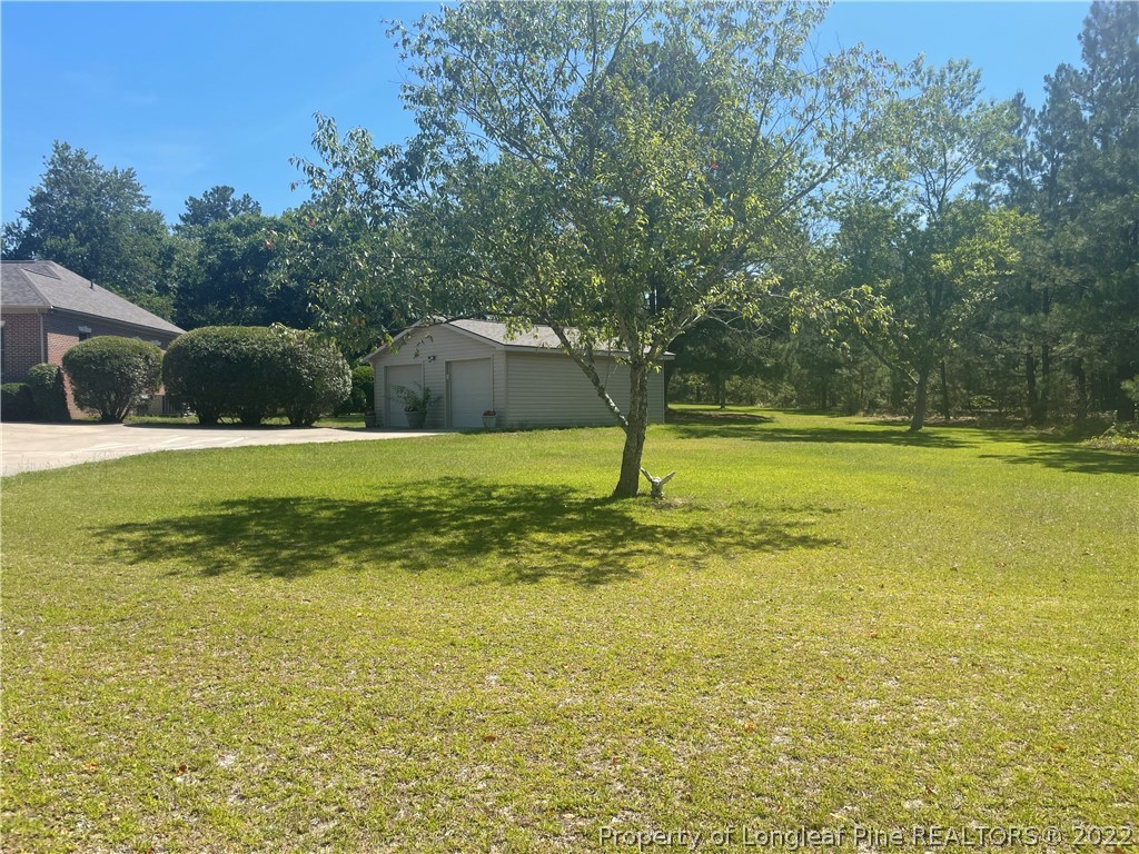 127 Doane Ranch Road Raeford, NC 28376 - Photo 9 of 47 a view of a pool with a yard