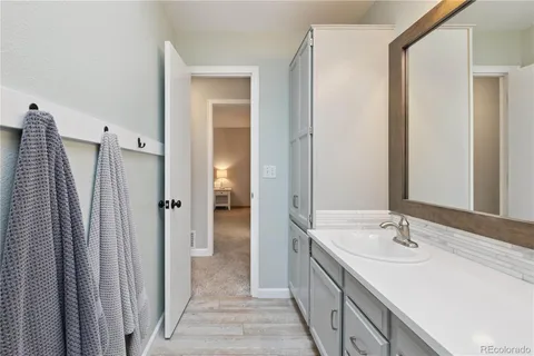 a bathroom with a double vanity sink and a mirror