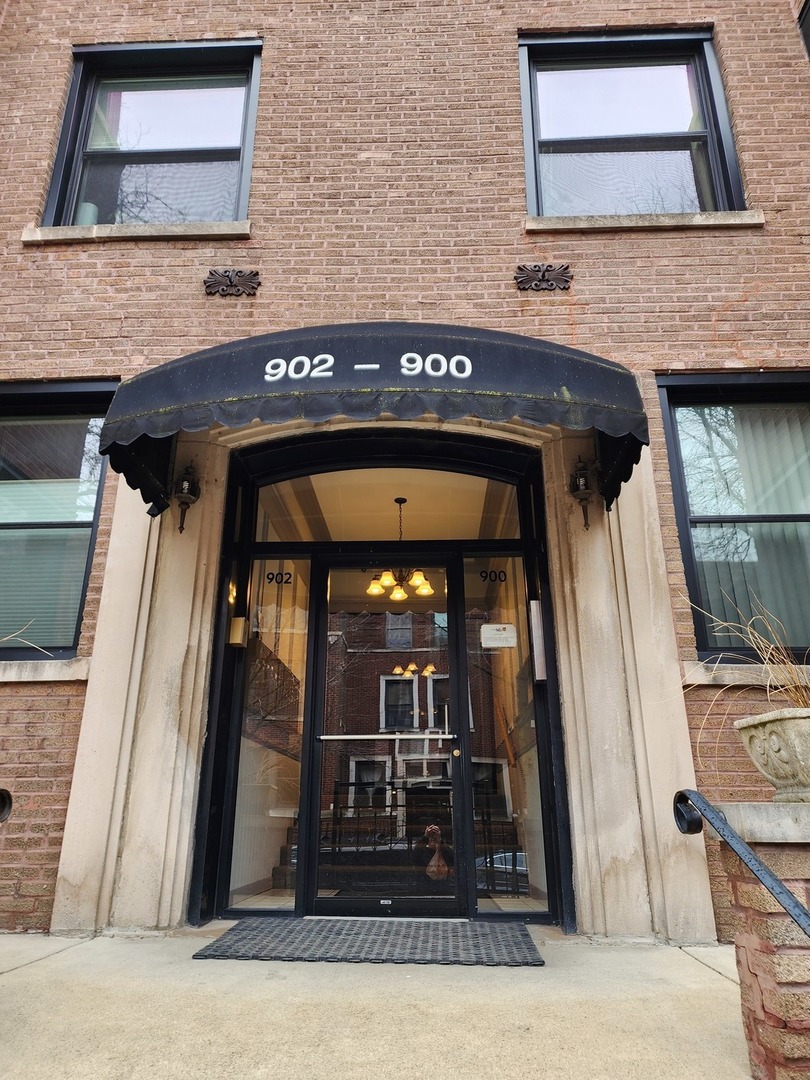 900 West Margate Terrace, Unit 2A Chicago, IL 60640 - Photo 2 of 21 a front view of a house with glass door