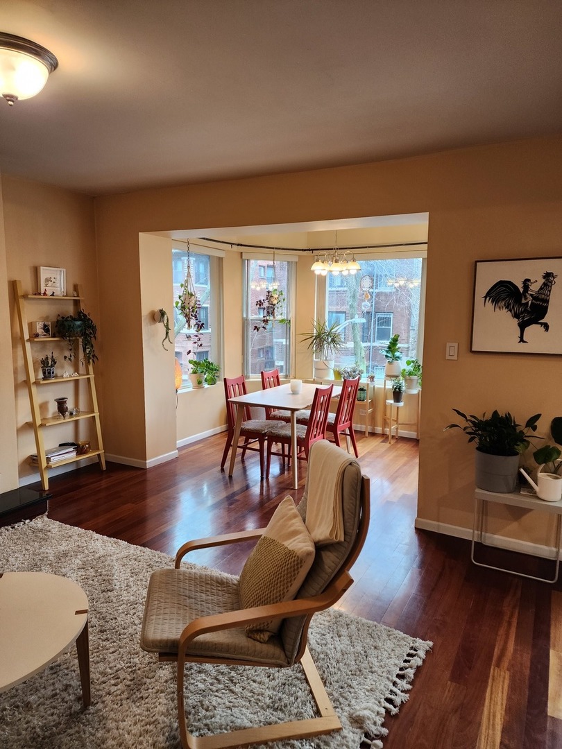 900 West Margate Terrace, Unit 2A Chicago, IL 60640 - Photo 9 of 21 a living room with furniture and a large window