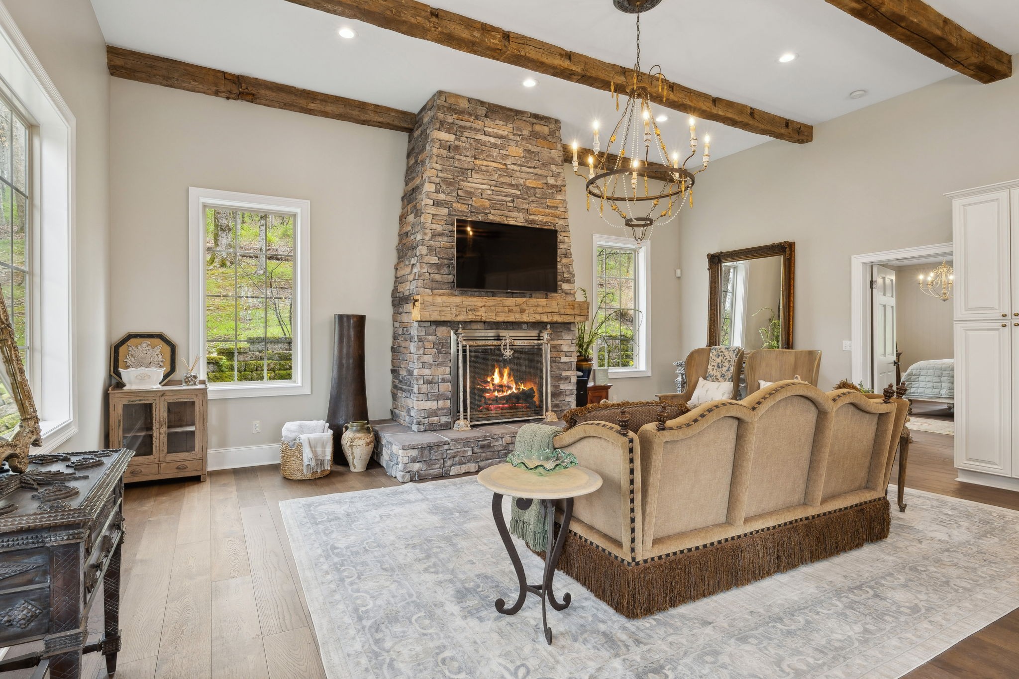 3110 McMillan Road Franklin, TN 37064 - Photo 13 of 96 a living room with furniture a flat screen tv and a fireplace