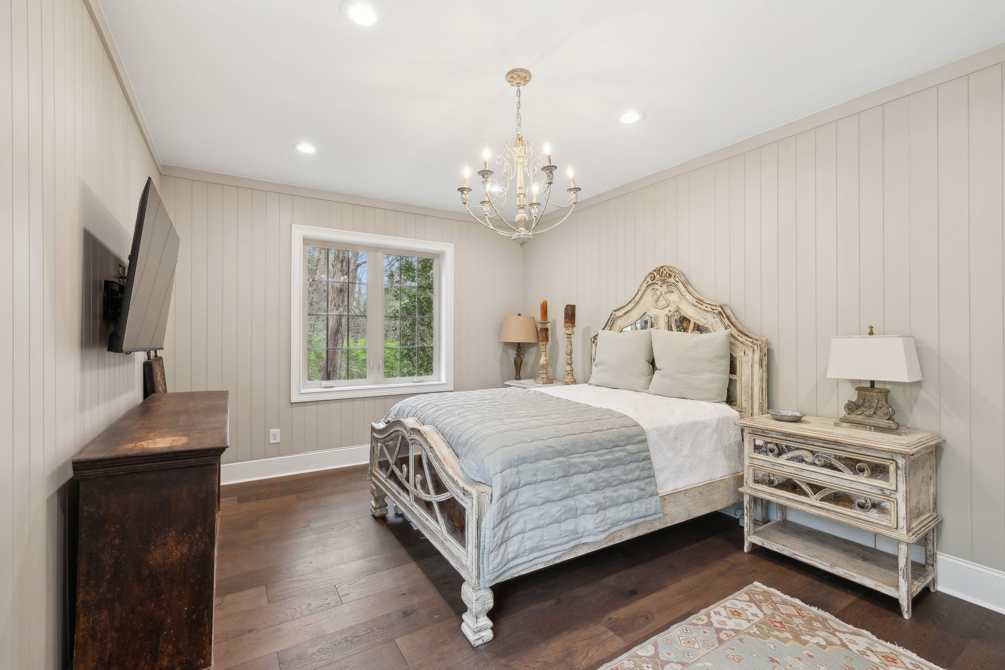 3110 McMillan Road Franklin, TN 37064 - Photo 25 of 96 a spacious bedroom with a bed and a flat tv screen on a dresser